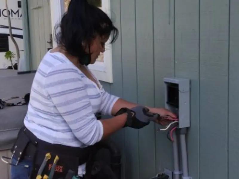 Licensed electrician wiring an exterior subpanel in Bushland